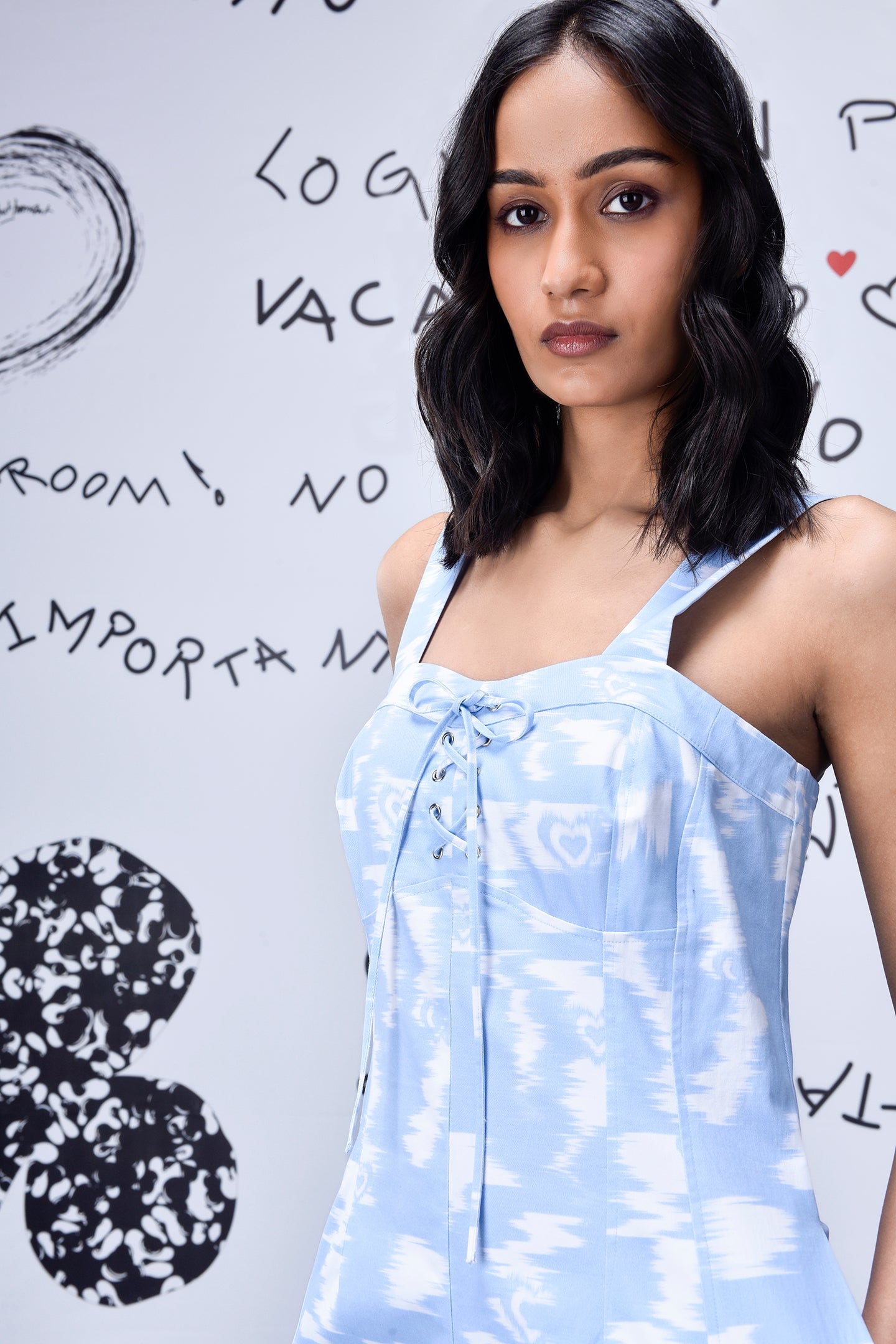 Stylera trendy ikat print jumpsuit in light blue with lace-up front detail