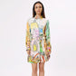 Stylera trendy long sleeve dress for spring featuring a colorful artistic print and a belted waist