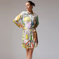 Stylera trendy long sleeve dress for spring with colorful artistic design and a cinched waist