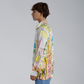 Stylera trendy long sleeve shirt for men with colorful abstract designs shown from the side view