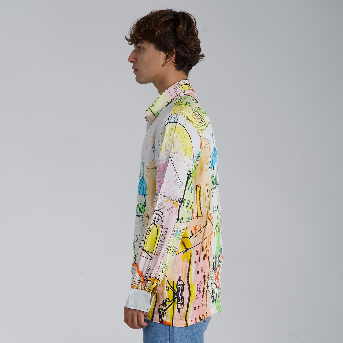 Stylera trendy long sleeve shirt for men with colorful abstract designs shown from the side view