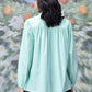 Stylera mint green long sleeve shirt back view on model trendy loose fit women's top with gathered yoke relaxed fit