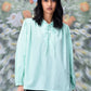 Stylera mint green blouse with lace up neckline and billowy sleeves trendy loose fit women's top