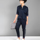 Stylish navy trendy matching outfits for women featuring a short-sleeve top and tapered pants