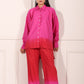 Trendy matching outfits for women featuring a vibrant pink gradient shirt and wide-leg pants