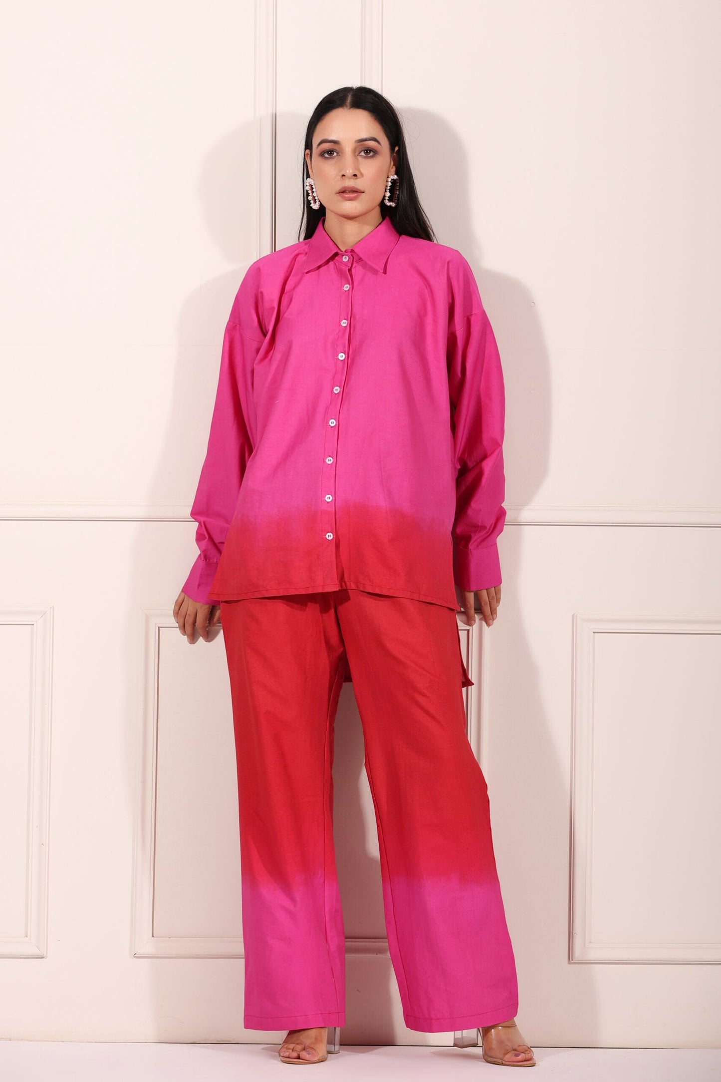 Trendy matching outfits for women featuring a vibrant pink gradient shirt and wide-leg pants