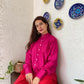 Stylish model wearing trendy matching outfits for women with a pink top and red pants