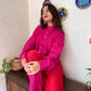 Trendy matching outfits for women featuring a pink button-up shirt and red pants