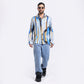 Stylera trendy men's long sleeve shirt in blue and gold stripes, styled with light jeans and sunglasses