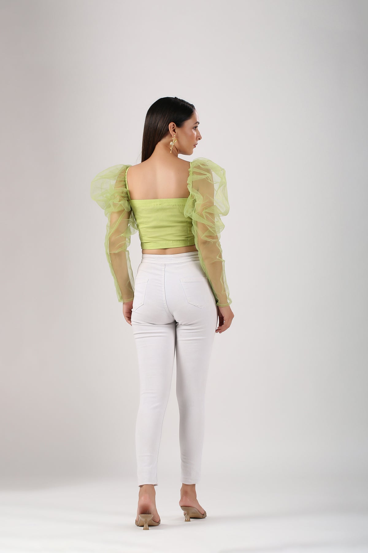 Trendy mesh crop top for women in vibrant green with puff sleeves and stylish back view