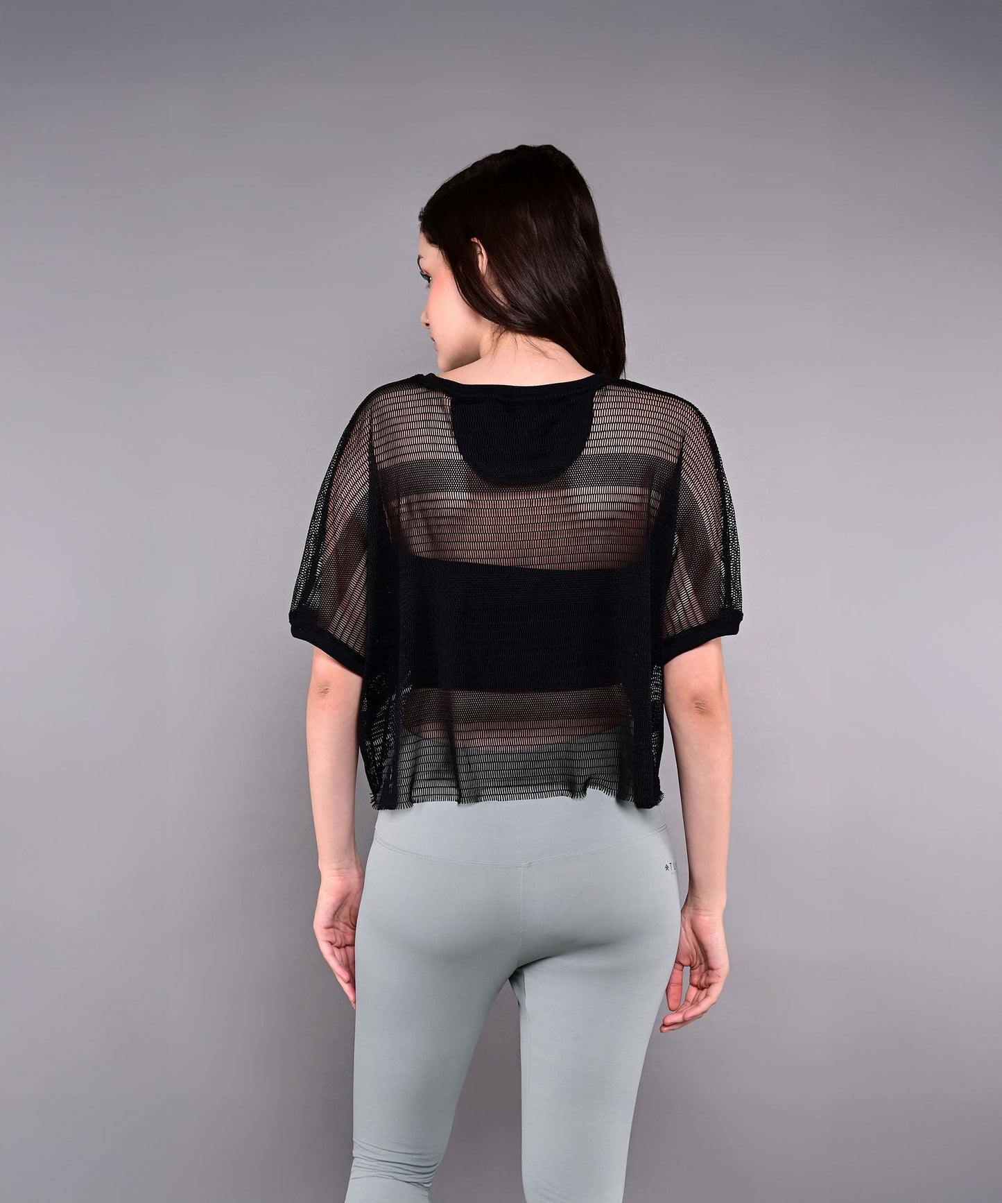 Stylish black trendy mesh tops for women with a relaxed fit and breathable fabric