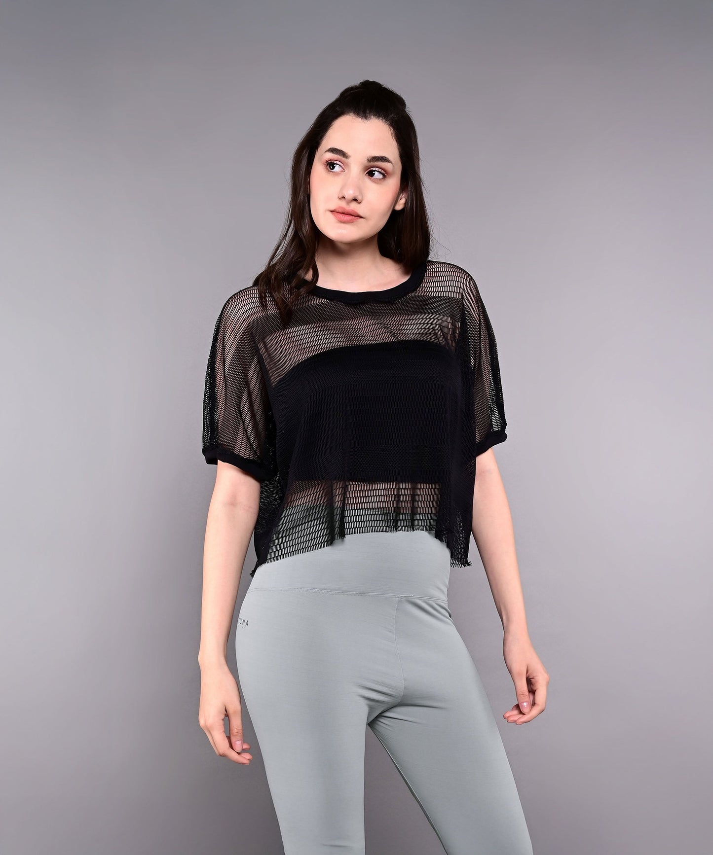 Black cropped trendy mesh tops for women with stylish sheer design for a modern look