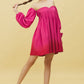 Stylish model wearing a trendy ombre mini dress for women with off-shoulder design and puff sleeves
