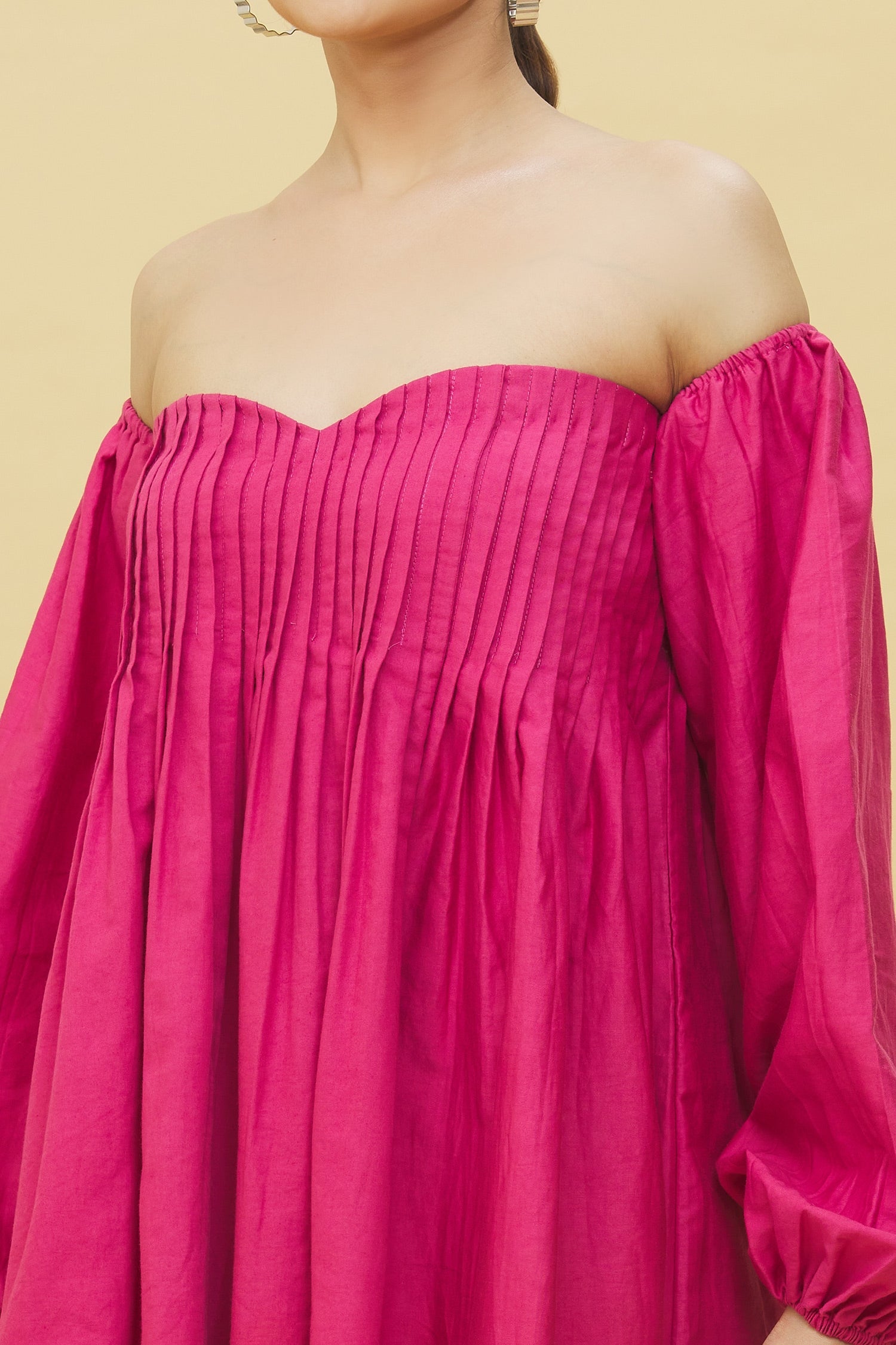 Trendy ombre mini dress for women in vibrant pink with off-shoulder design and pleated details