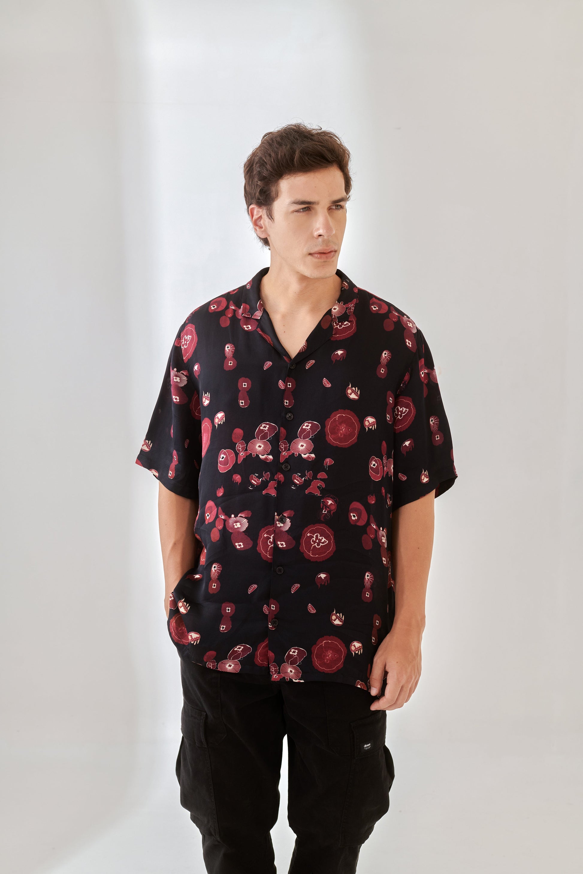 Trendy oversized button up shirt in black with floral print for a stylish, relaxed look
