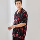 Trendy oversized button up shirt in black with red floral print for casual wear