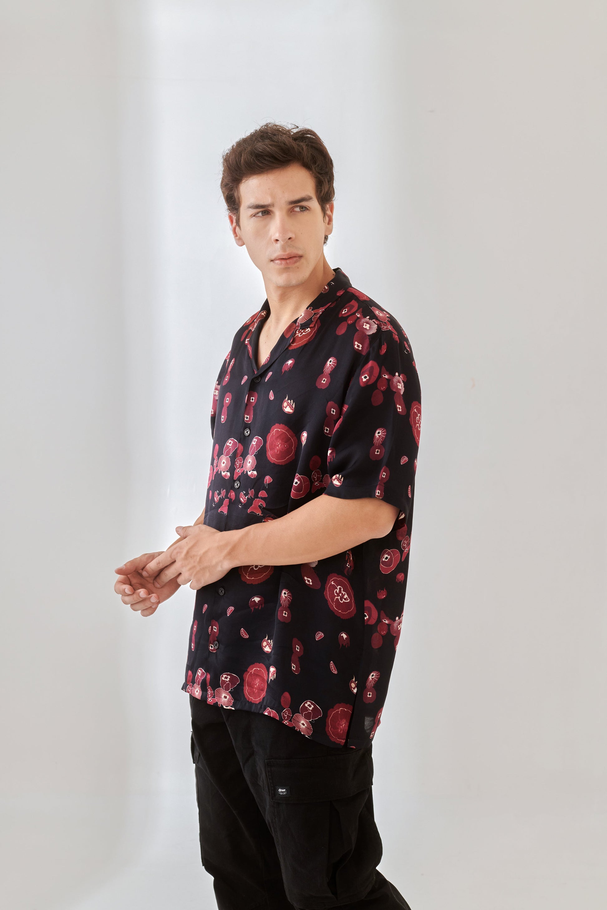 Trendy oversized button up shirt in black with red floral print for casual wear