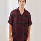 Trendy oversized shirt for men in dark purple with abstract print, perfect for casual outfits.