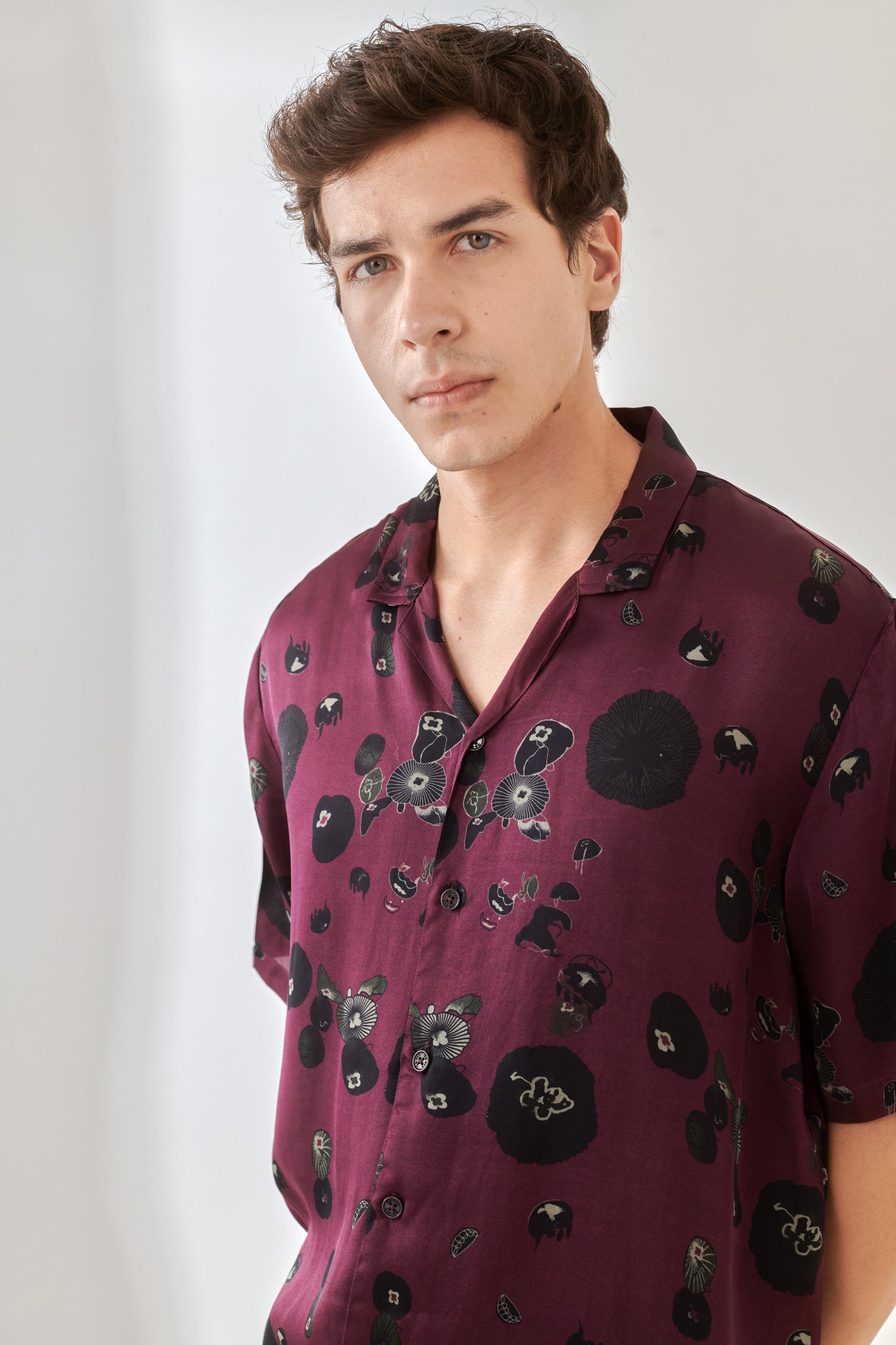 Trendy oversized shirt for men in burgundy with unique floral designs for a stylish casual look
