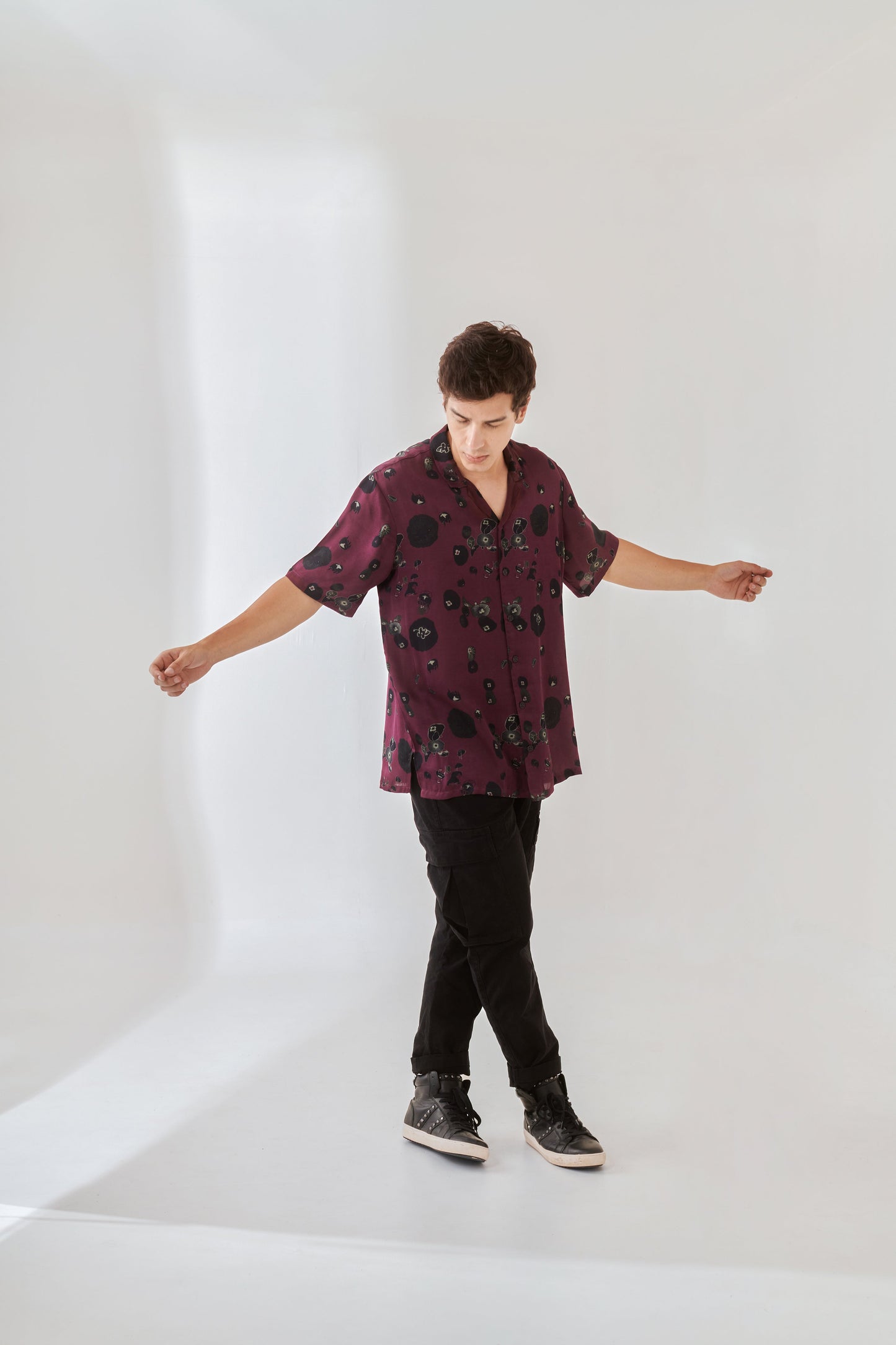 Trendy oversized shirt for men in burgundy with a stylish printed design, perfect for casual wear.