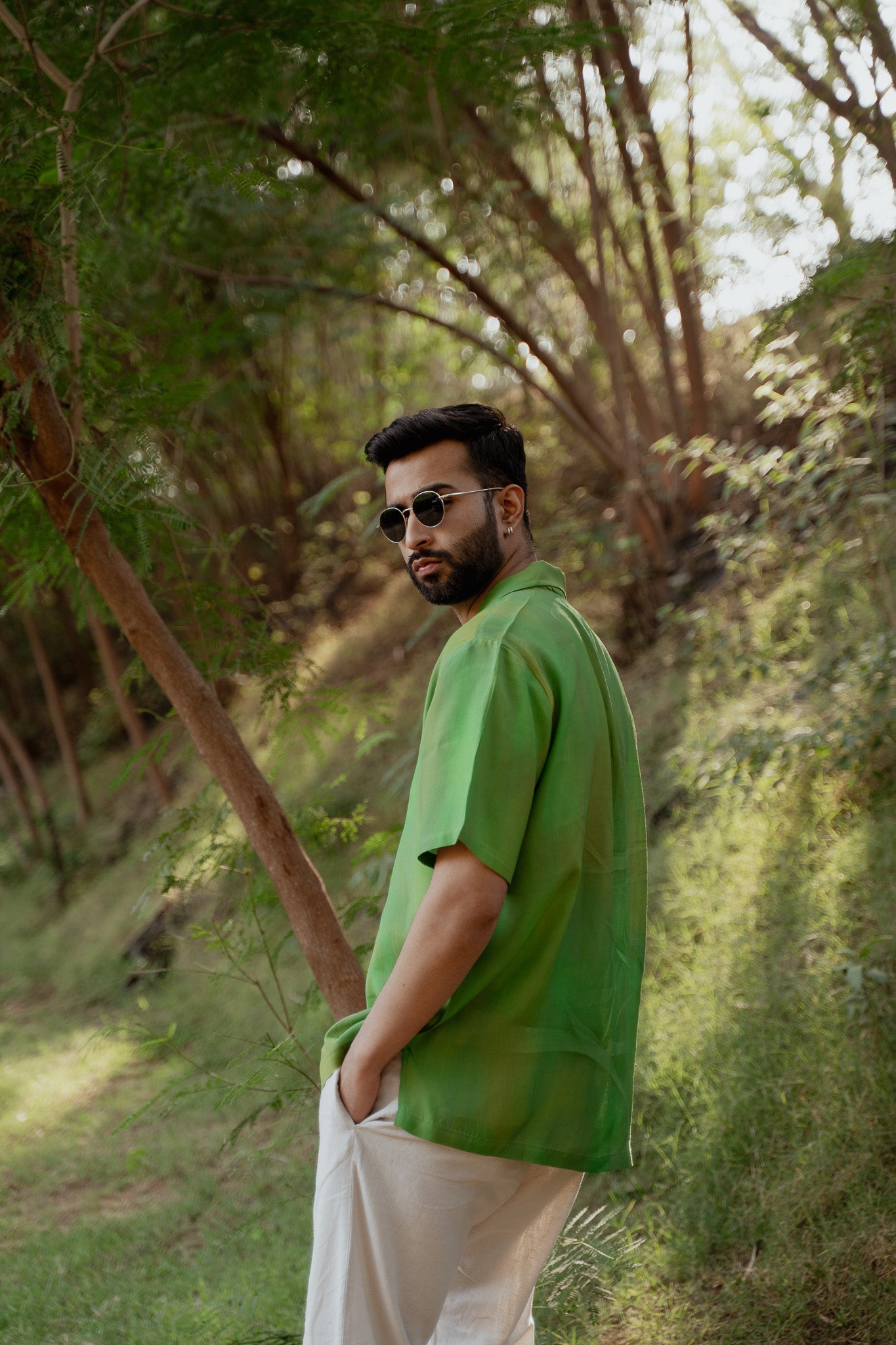 Trendy oversized shirt for men in vibrant green, perfect for casual outdoor settings