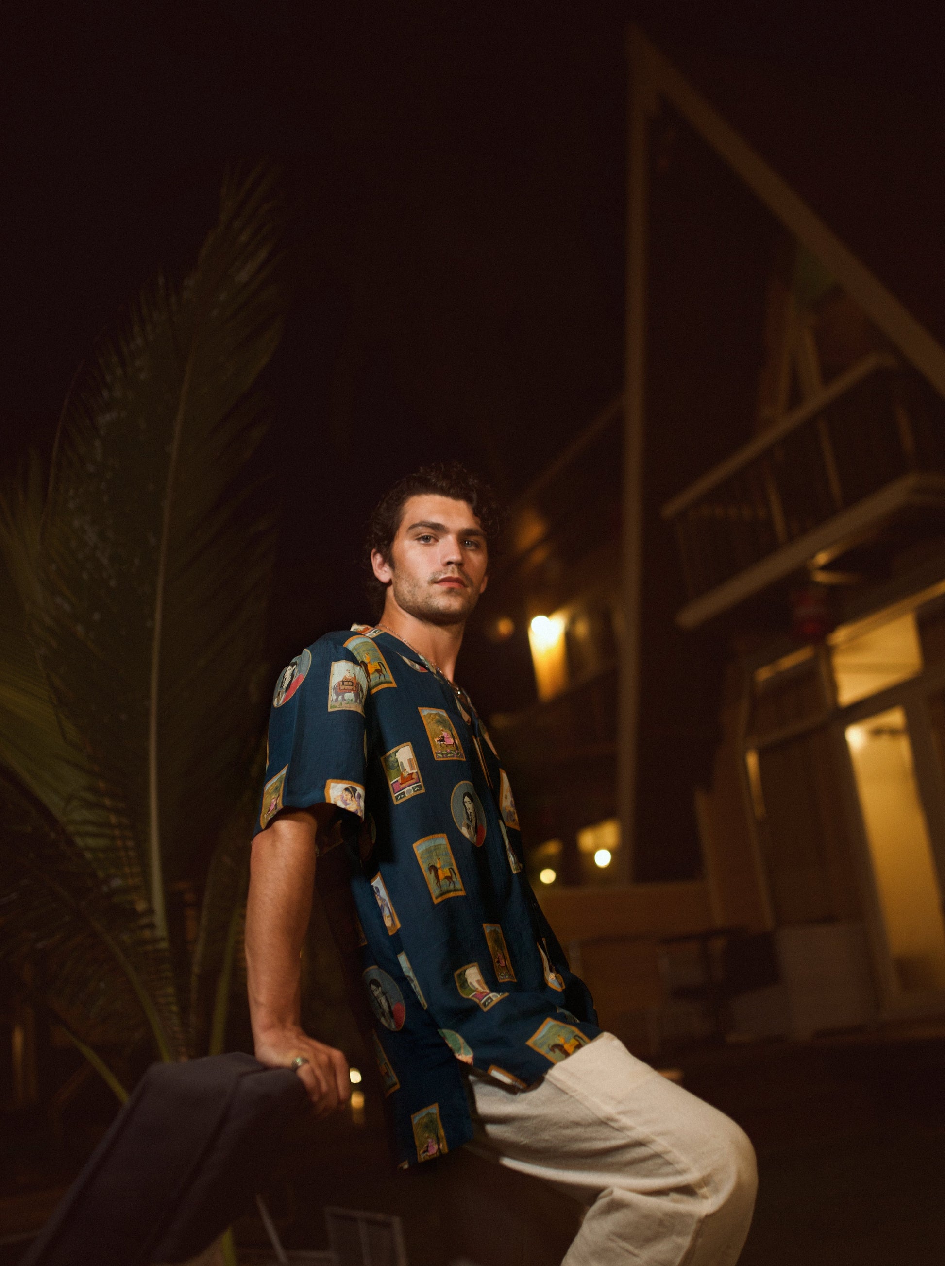 Trendy oversized shirt for men in navy with a unique print, styled for a casual evening look