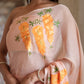 Trendy peach saree with floral design featuring vibrant embroidery and elegant draping