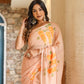 Elegant model wearing a trendy peach saree with floral design, showcasing beautiful embroidery and light fabric