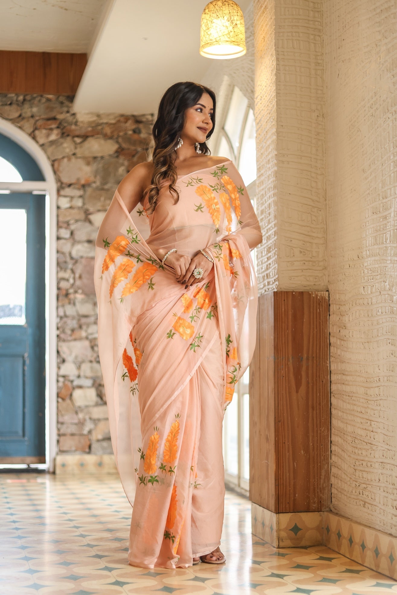 Trendy peach saree with floral design featuring elegant embroidery and lightweight fabric