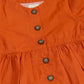 Trendy peplum shirt for women in orange with button detailing and gathered waist for a stylish look
