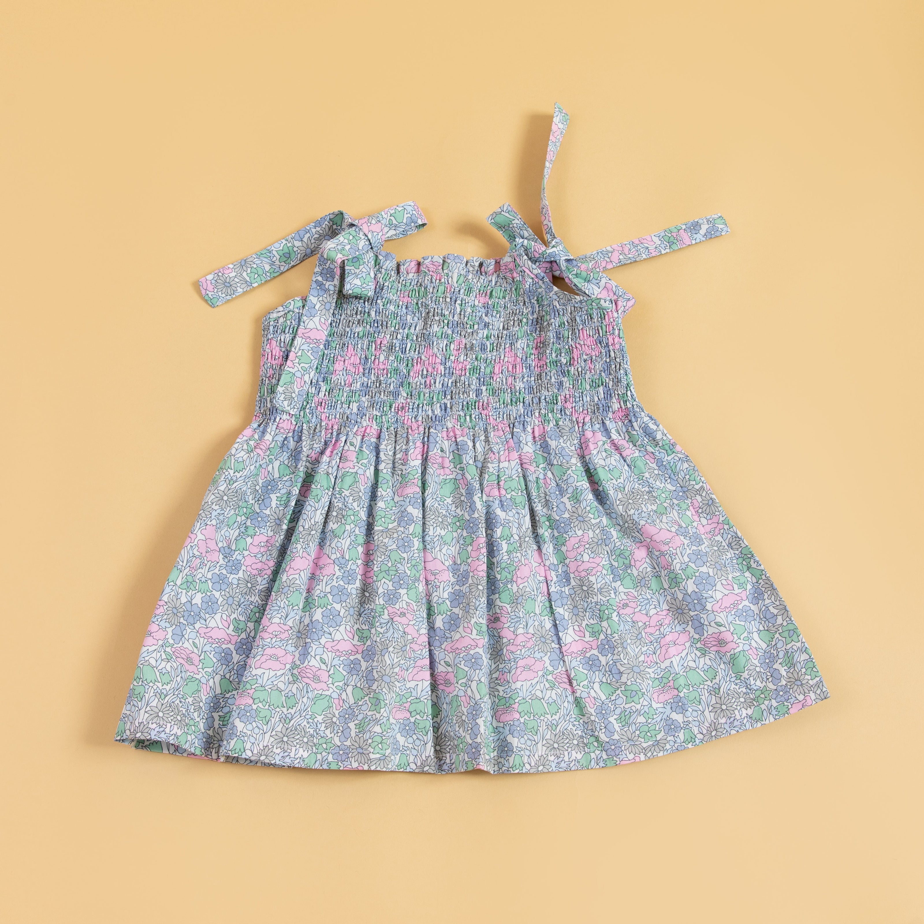 Trendy pink casual dress with floral pattern and adjustable tie straps for comfort