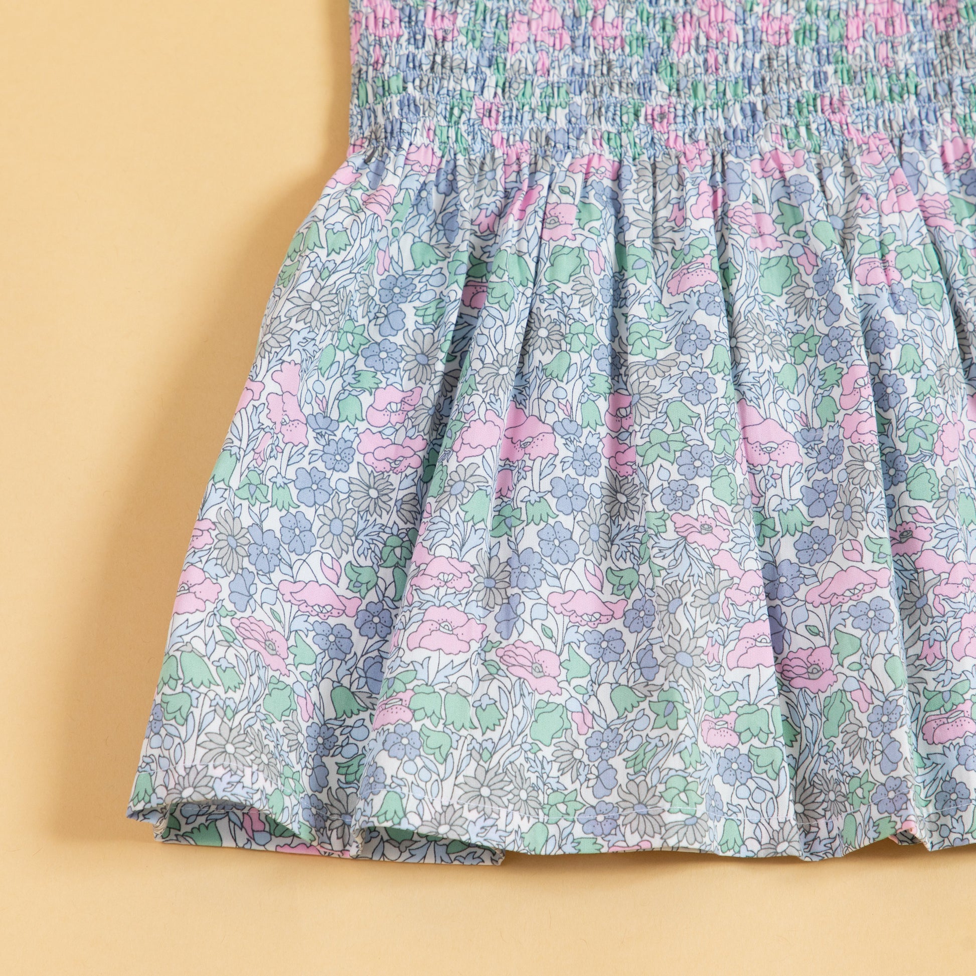 Stylera trendy pink casual dress with a floral pattern and smocked bodice for a comfortable fit
