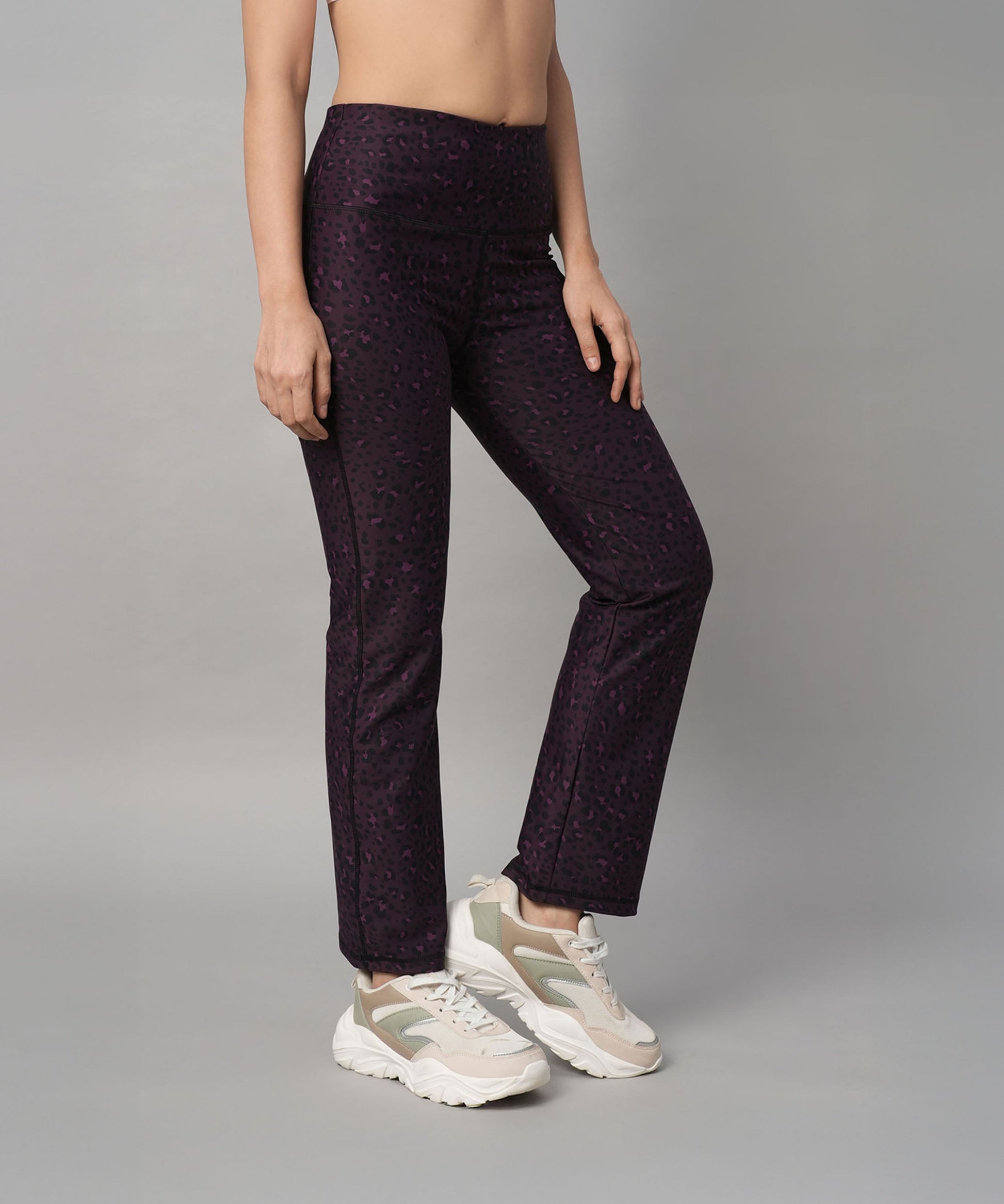 Stylish purple yoga pants, perfect for workouts or lounging, featuring a trendy pink yoga leggings design