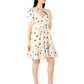 Trendy polka dots midi dress in cream with black dots and a ruffled hem for stylish summer wear