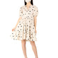 Model wearing a trendy polka dots midi dress with puff sleeves and matching face mask