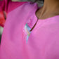 Close-up of a trendy printed co-ord set for women featuring a vibrant pink design and artistic details