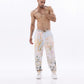 Stylera trendy relaxed fit pants featuring a colorful abstract design for a comfortable and stylish look