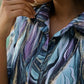 Trendy satin pajamas set with a stylish purple and blue wave pattern, perfect for lounging or sleepwear