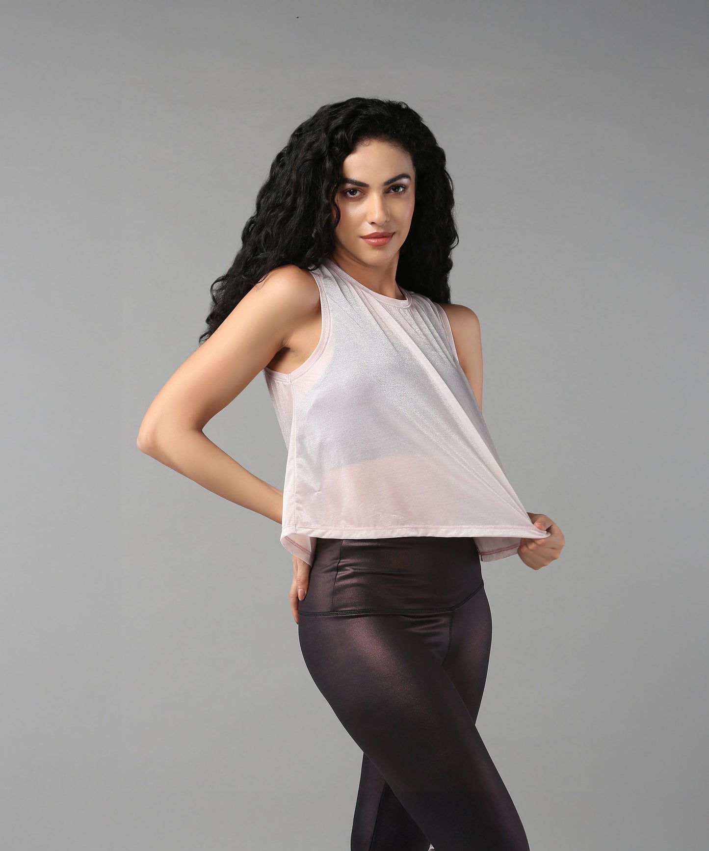 Trendy sheer crop tops for women in soft pink, perfect for stylish casual outfits.