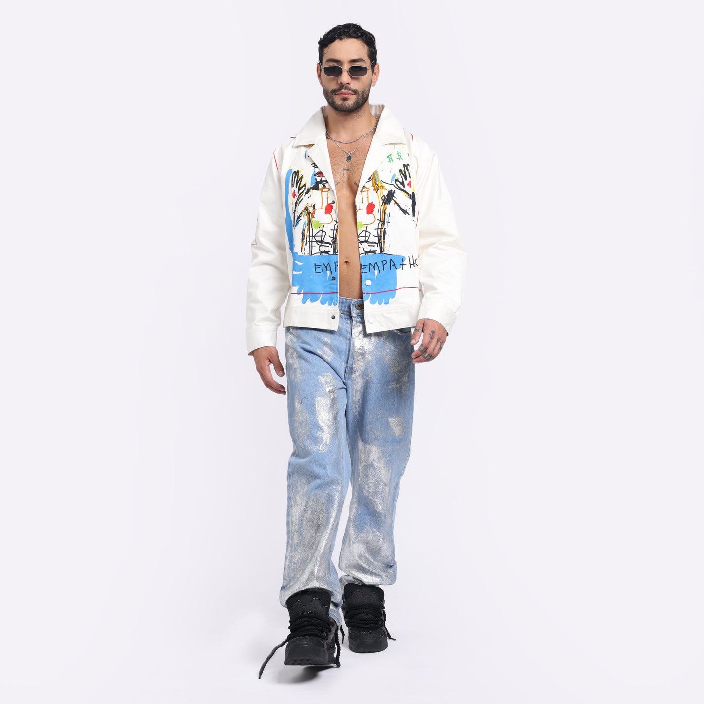 Trendy silver washed denim pants styled with a colorful jacket for a modern look