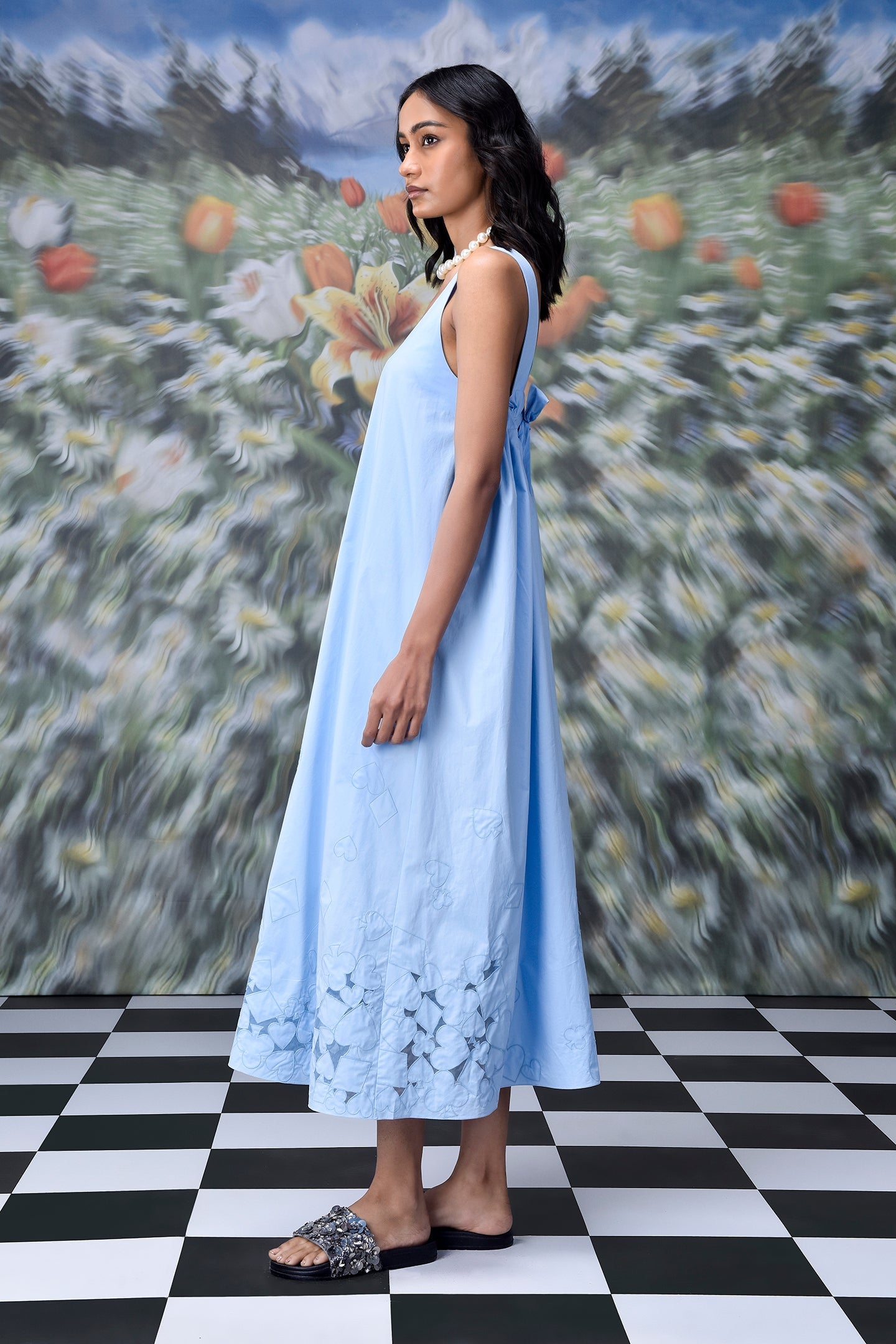 Stylera light blue sleeveless maxi dress with bow back and floral cutout hem on model trendy sleeveless maxi dresses