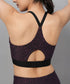 Trendy sports bras with back design featuring a stylish cutout and adjustable straps in a purple leopard print
