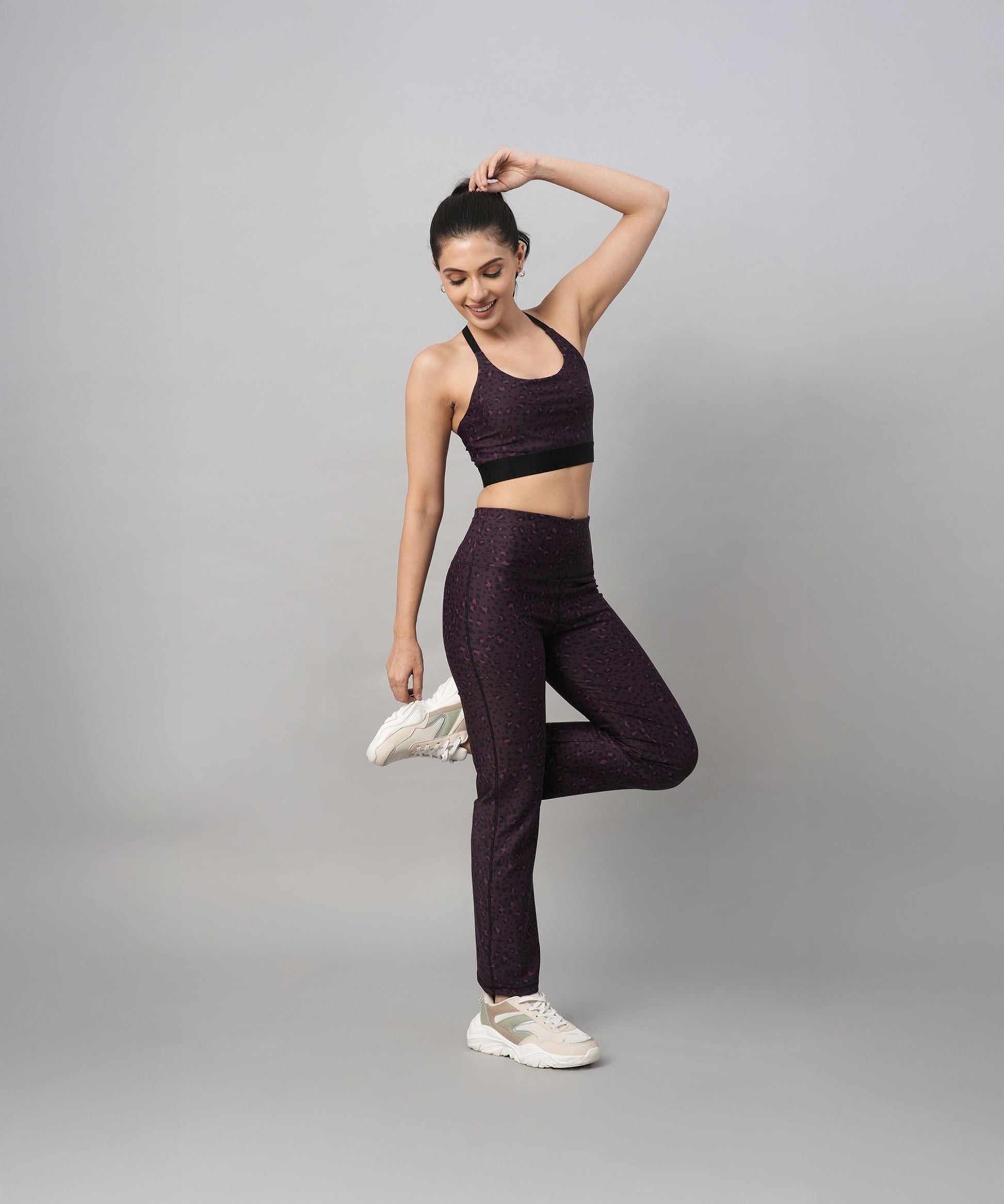 Stylera trendy sports bras with back design paired with matching leggings for activewear