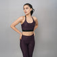 Stylera trendy sports bras with back design in purple worn with matching leggings