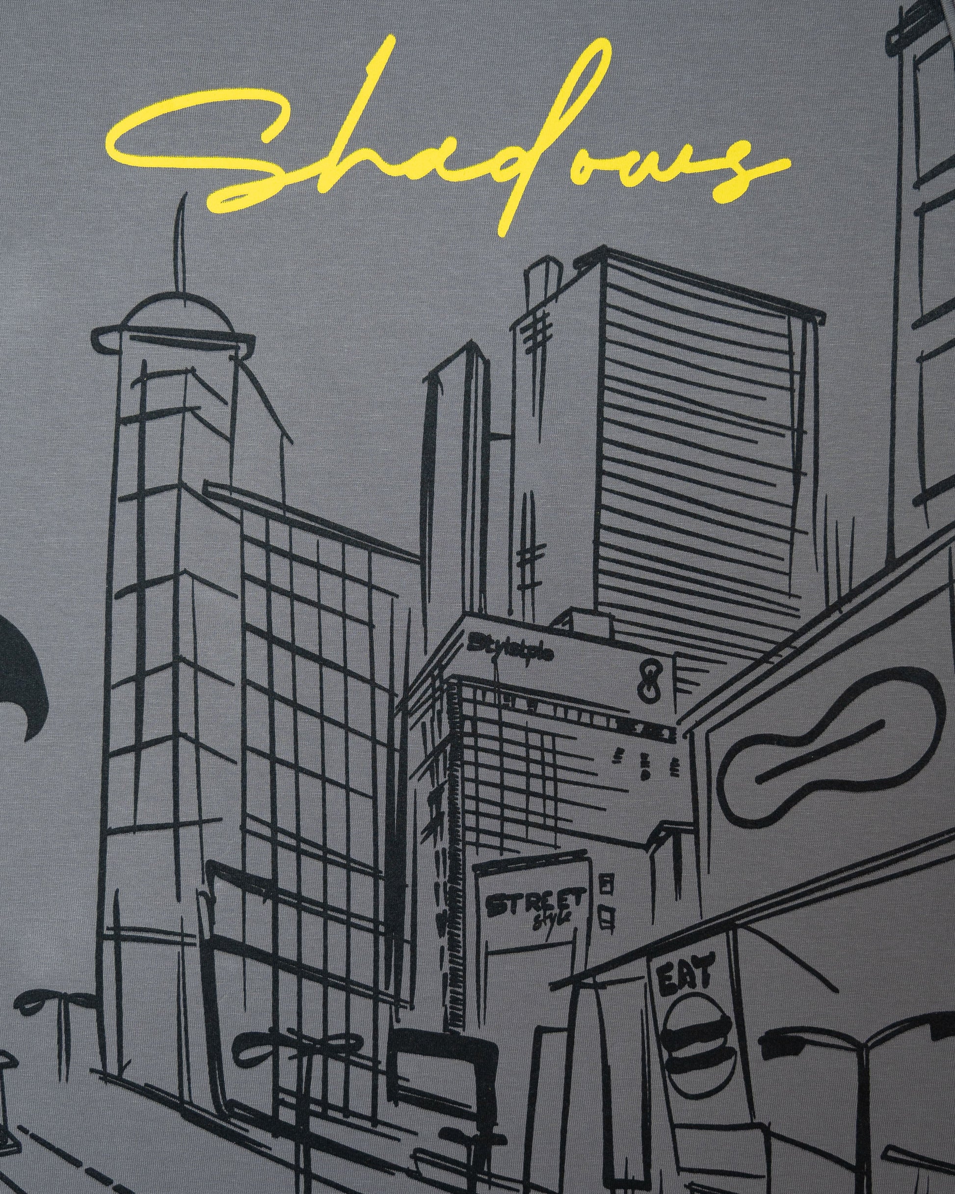Stylstpls trendy statement oversized t-shirt with artistic cityscape design and yellow 'Shadows' text