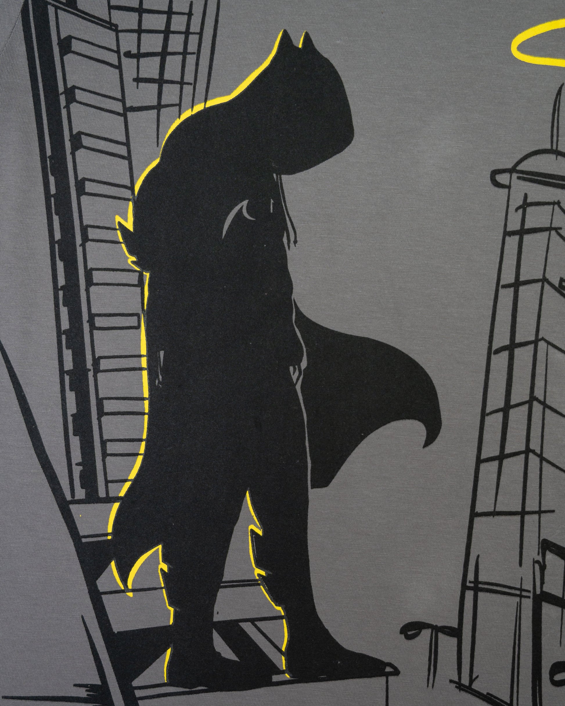 Stylstpls trendy statement oversized t-shirt featuring a bold graphic design of a superhero silhouette