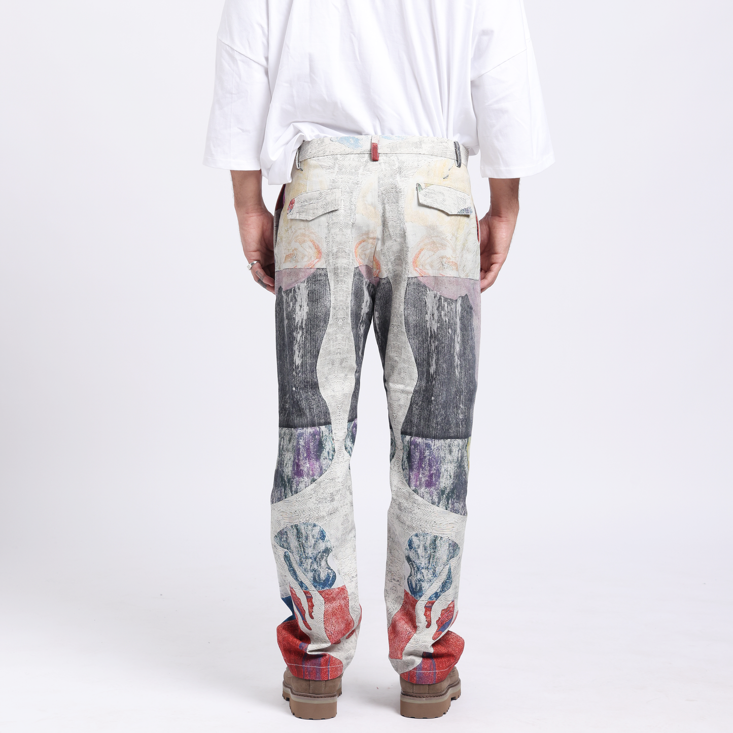 Stylera trendy statement pants for men featuring a unique artistic design and relaxed fit from the back view