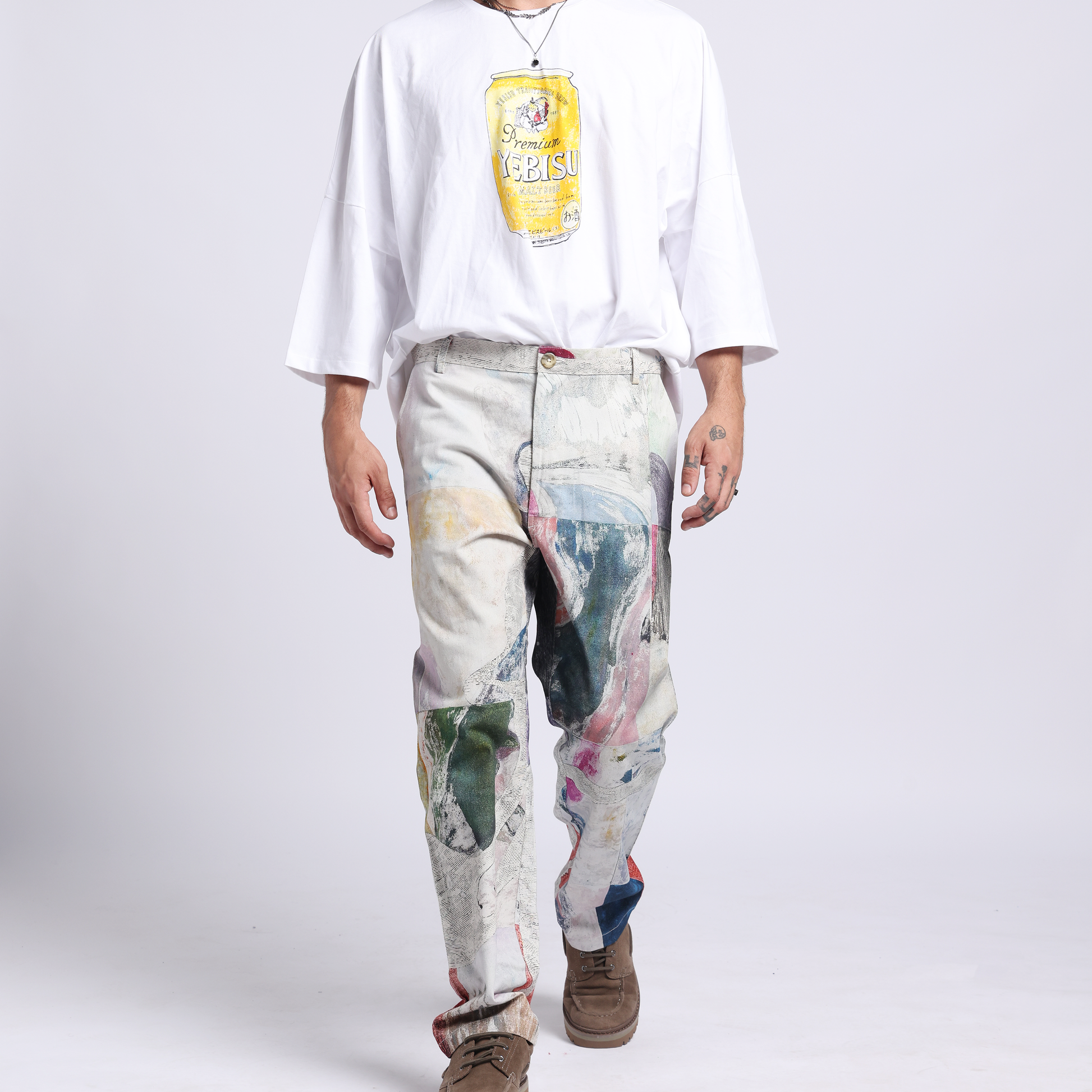 Stylera trendy statement pants for men in a unique artistic design paired with a casual white shirt