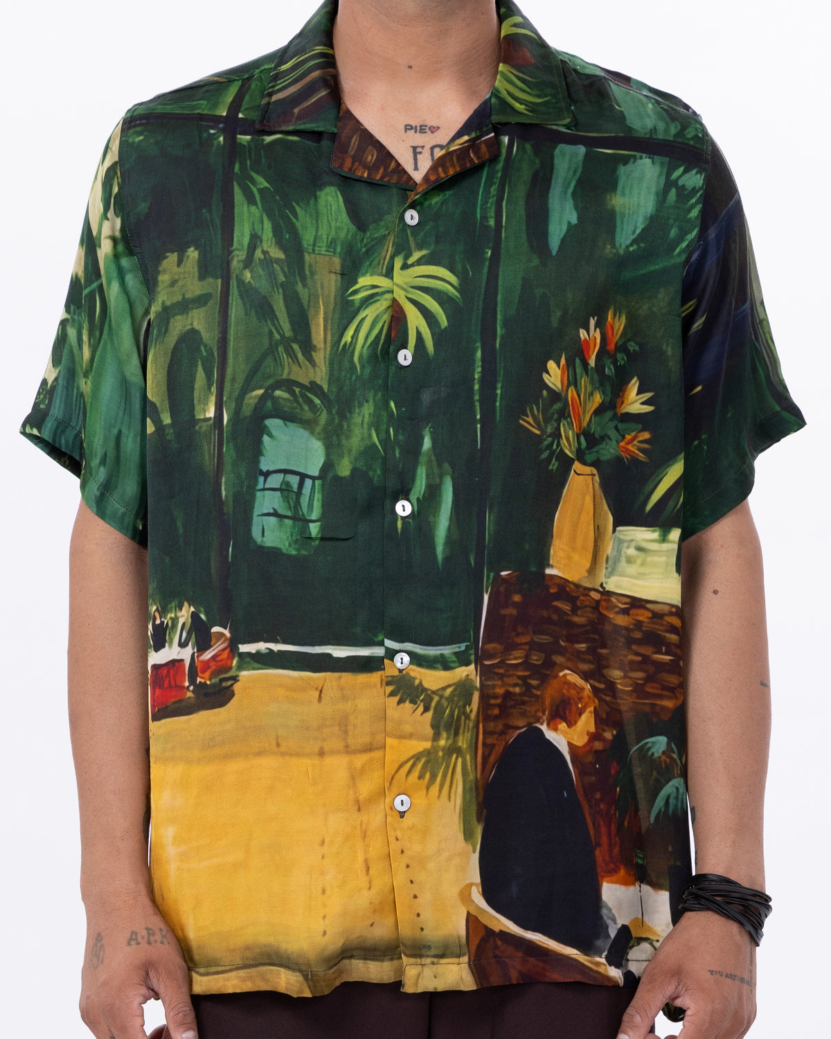Stylera trendy statement shirts for men featuring a vibrant tropical design with palm trees and flowers