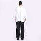 Back view of Stylera trendy streetwear t-shirt men in white fabric paired with black jeans